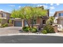 Charming two-story home with mature landscaping, a paver driveway, and a two-car garage at 12254 Cape Cortez Ct, Las Vegas, NV 89138