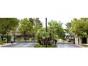 Beautiful Belvedere community entrance with gated entry and lush landscaping at 129 Sapodilla Ln, Las Vegas, NV 89144