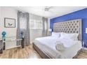 Bright bedroom with a tufted headboard bed, stylish decor, and natural light at 1508 Dorothy Ave # 4, Las Vegas, NV 89119