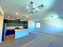 Open-concept kitchen with modern island, stainless appliances, and sleek cabinetry at 20 Barbara Ln # 47, Las Vegas, NV 89183