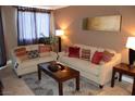 Bright living room featuring stylish sofas, throw pillows, and modern decor at 220 E Flamingo Rd # 104, Las Vegas, NV 89169