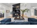 Bright, airy living room showcasing a modern fireplace, high ceilings, and stylish decor at 2337 Prometheus Ct, Henderson, NV 89074