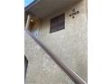 Exterior view of the building with unit number, showing stucco siding and stairs at 4748 Obannon Dr # C, Las Vegas, NV 89102