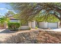 Attractive single-story home with a two-car garage and desert-friendly landscaping at 5705 Sovereign Way, Las Vegas, NV 89130
