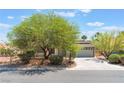 A charming single-story home with a well-manicured front yard and a two-car garage at 5705 Sovereign Way, Las Vegas, NV 89130
