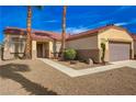 Welcoming home featuring desert landscaping, and a quaint walkway leading to the front door at 6128 Casper Sands Ct, North Las Vegas, NV 89031