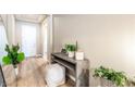 Inviting entryway with hardwood floors, stylish console table, and neutral decor at 715 Drammatico Pl, Henderson, NV 89011