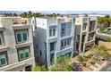 Stylish two-story home featuring a rooftop patio and sleek design, nestled in a vibrant community at 8016 Carpenter Creek Ave, Las Vegas, NV 89113