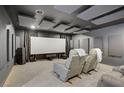 A cozy theater room equipped with plush seating, projector, and acoustic panels at 8016 Carpenter Creek Ave, Las Vegas, NV 89113
