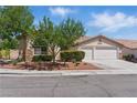 Charming single-story home with a two-car garage and well-maintained landscaping at 8114 Lapis Harbor Ave, Las Vegas, NV 89117
