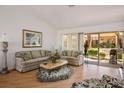 Bright living room with a sliding glass door, plush sofas, and a cozy rug at 8929 Marble Dr, Las Vegas, NV 89134