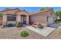 Attractive one-level house featuring a landscaped front yard and a attached two-car garage at 1931 Jasper Creek Pl, Las Vegas, NV 89123