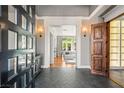 Beautiful foyer featuring herringbone tile floors and an open view to living space at 2369 Green Mountain Ct, Las Vegas, NV 89135