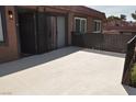 Condo exterior featuring a private outdoor patio with railing, perfect for relaxing and entertaining guests at 250 Shadybrook Ln # D, Las Vegas, NV 89107