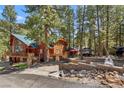 Charming log home nestled among the trees with beautiful stonework at 274 Ski Trail Rd, Mount Charleston, NV 89124