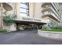 The Regency Towers entrance features manicured landscaping at 3111 Bel Air Dr # 12E, Las Vegas, NV 89109