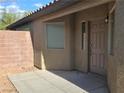 Cozy front entrance featuring a gray door, and desert landscaping at 3388 Old Course St, Las Vegas, NV 89122