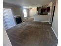 Inviting living room with fireplace, adjoining kitchen and lots of natural light at 4050 Pacific Harbors Dr # 217, Las Vegas, NV 89121