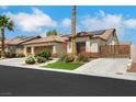 Inviting home with desert landscaping, three-car garage, and tile roof, perfect for low-maintenance living at 4128 Tarkin Ave, Las Vegas, NV 89120