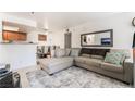 Comfortable living room featuring a large sectional sofa, decorative pillows, and view of the dining area at 4200 S Valley View Blvd # 1074, Las Vegas, NV 89103