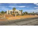 Charming single-story home with stucco exterior, desert landscaping, and a spacious driveway at 440 N Lisbon St, Henderson, NV 89015