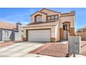 Charming two-story home featuring a tile roof, neutral stucco, and an attached two-car garage at 4514 Calico Cliff Ct, North Las Vegas, NV 89031