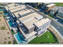 Modern home with pool, spa, outdoor kitchen, and artificial grass at 5429 Succulent Rose Dr, Las Vegas, NV 89135