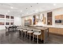 Modern, spacious kitchen with large island, stainless steel appliances, and dark wood flooring at 5429 Succulent Rose Dr, Las Vegas, NV 89135