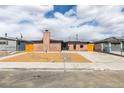 Charming single-story home with a unique brick facade and modern landscaping at 5800 Balzar Ave, Las Vegas, NV 89108