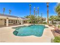 Relaxing backyard pool with multiple access points, providing the perfect space for outdoor enjoyment and recreation at 7300 Breezy Night Ct, Las Vegas, NV 89129