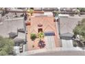 Aerial view of a single Gathering home with tile roofing, desert landscaping, and a private backyard pool at 7909 Sierra Rim Dr, Las Vegas, NV 89131
