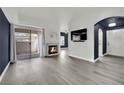 Bright living room featuring fireplace, slider, and modern decor, ready for relaxation at 8408 White Eagle Ave # 101, Las Vegas, NV 89145