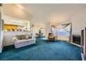 Spacious living area showcasing comfortable seating, fireplace, and seamless transition to a dining area at 8450 Alta Dr # 225, Las Vegas, NV 89145