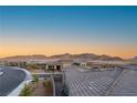 Gorgeous aerial view of neighborhood with beautiful views of mountains in the background at 964 Edinburgh Fields Ct, Las Vegas, NV 89138