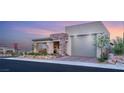 Beautiful single-story home featuring a stone facade and a well-manicured front yard at 964 Edinburgh Fields Ct, Las Vegas, NV 89138