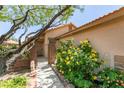 Inviting front entrance with desert landscaping and a gated entry at 11073 Gateview Ln, Las Vegas, NV 89144