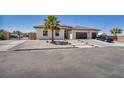Charming single-story home featuring a tile roof, desert landscaping, and a spacious driveway at 12720 Davis Wright Ct, Henderson, NV 89044