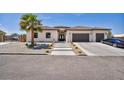 Charming single-story home featuring a tile roof, desert landscaping, and a spacious driveway at 12720 Davis Wright Ct, Henderson, NV 89044