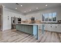 Bright kitchen features a large island, stainless appliances, and decorative tile backsplash at 1790 Castro Hill Ave, Henderson, NV 89012
