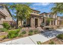 Charming two-story home with stone accents, landscaped front yard, and inviting curb appeal at 2116 Via Firenze, Henderson, NV 89044