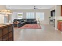 Comfortable living room featuring a leather sofa and a large window at 2132 Twin Falls Dr, Henderson, NV 89044