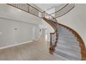Entry way featuring a staircase, high ceilings, and views into other rooms of the home at 2595 Aviv Ct, Las Vegas, NV 89121