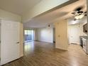 Spacious living room with wood flooring and a sliding door to the balcony at 2606 S Durango Dr # 171, Las Vegas, NV 89117