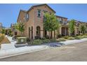 Two-story home exterior featuring a landscaped front yard and covered entrance at 2862 Starling Summit St, Henderson, NV 89044