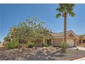 Beautiful single-story home featuring a landscaped front yard and a mature palm tree, offering curb appeal at 3012 Haddon Dr, Las Vegas, NV 89134