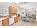 Eat-in kitchen area featuring wood cabinetry, stone countertops, and stainless steel appliances at 3056 Monroe Park Rd, Henderson, NV 89052