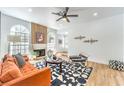 Cozy living room with a fireplace, large windows, and stylish decor at 3104 Waterview Dr, Las Vegas, NV 89117
