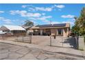 A single-story home with solar panels, a fenced yard, and a spacious private driveway at 3112 Twining Ave, North Las Vegas, NV 89030