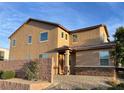 Attractive home featuring stucco siding, stone accents, and mature landscaping at 4902 Guysborough St, Las Vegas, NV 89148