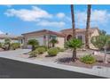 Charming single-story home features desert landscaping, an attached two-car garage, and a tiled roof at 5078 Rivedro St, Las Vegas, NV 89135